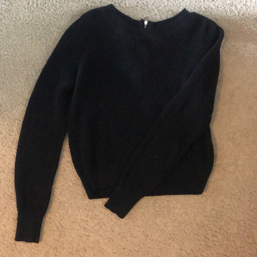 Black sweater with silver zipper